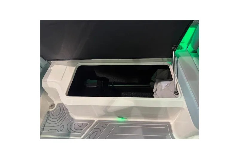 Slide: The Image of Open storage compartment in 2026 Regal LS6 Surf boat interior. - 29