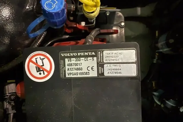 Slide: The Image of Volvo Penta engine label on 2026 Regal LS6 Surf boat, showing model and serial numbers. - 32