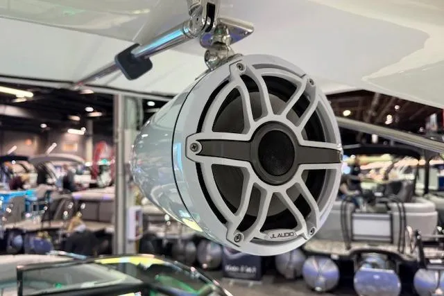 Slide: The Image of 2026 Regal LS6 Surf boat with JL Audio speaker in showroom. - 33