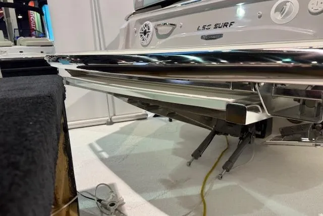 Slide: The Image of 2026 Regal LS6 Surf boat rear view with sleek chrome detailing. - 35