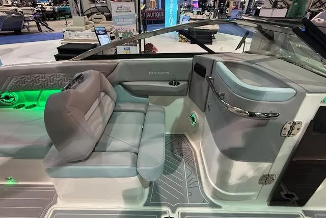 Slide: The Image of 2026 Regal LS6 Surf boat interior with modern seating and ambient lighting. - 9