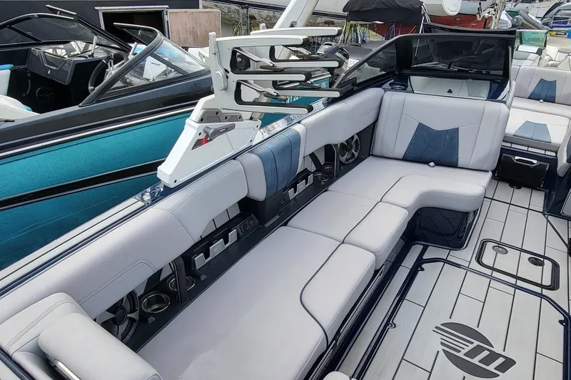 Slide: The Image of 2021 Malibu Wakesetter 23 MXZ interior with spacious seating and modern design. - 10