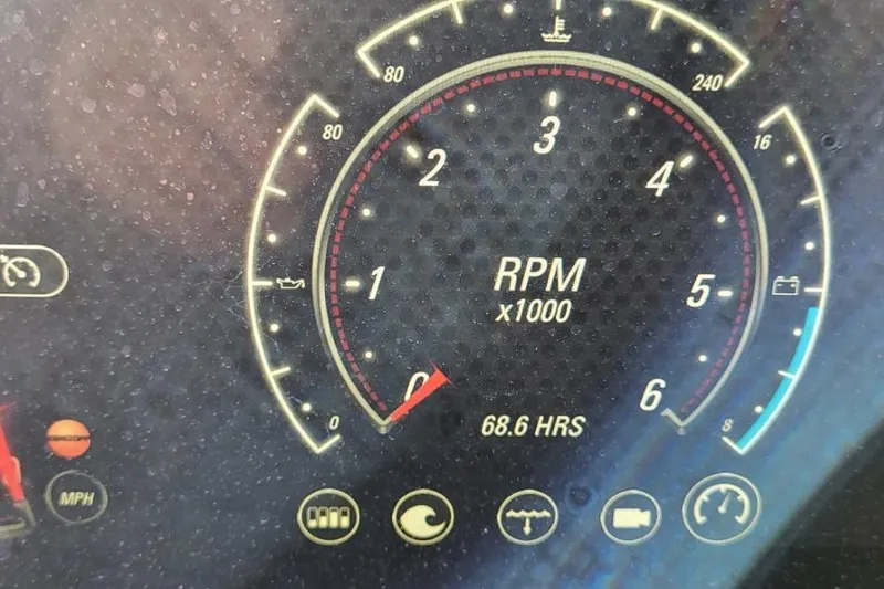 Slide: The Image of Close-up of 2021 Malibu Wakesetter 23 MXZ tachometer showing 68.6 hours and RPM gauge. - 13