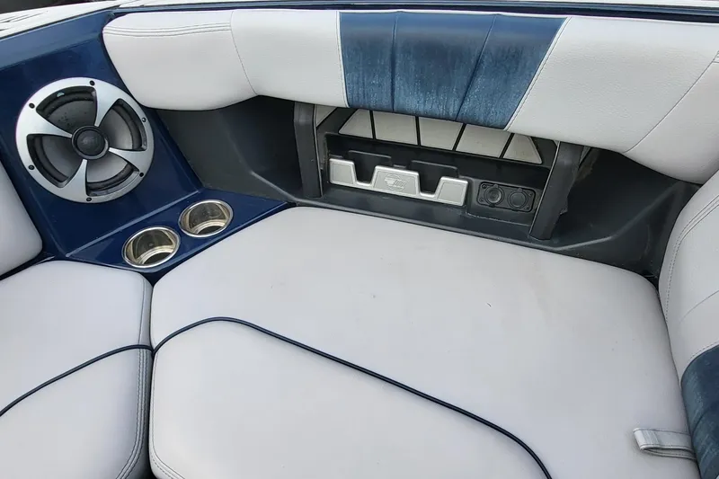 Slide: The Image of Interior of 2021 Malibu Wakesetter 23 MXZ with speaker, cup holders, and cushioned seating. - 17