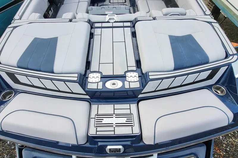 Slide: The Image of 2021 Malibu Wakesetter 23 MXZ boat interior with sleek seating and modern design. - 8