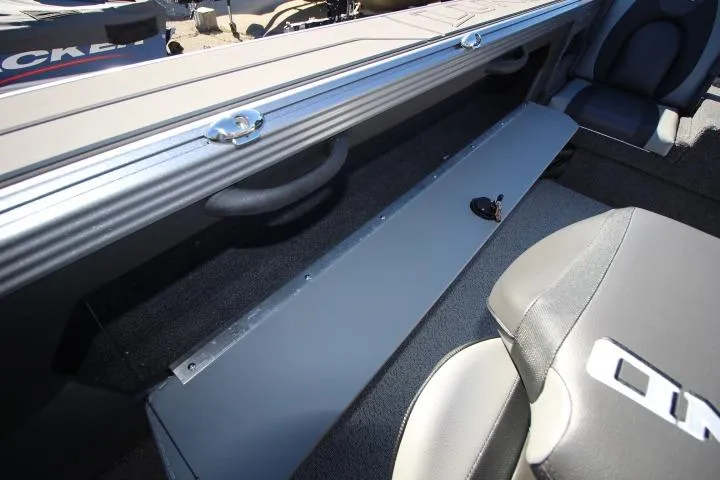 Slide: The Image of 2026 Lund 2275 Baron boat interior with seating and storage compartment. - 13