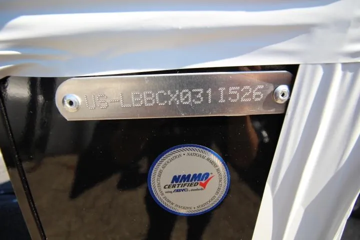 Slide: The Image of 2026 Lund 2275 Baron boat with NMMA certification plate and serial number. - 24