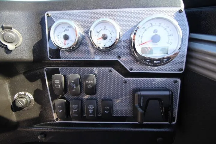 Slide: The Image of Dashboard of 2026 Lund 2275 Baron boat with gauges and control switches. - 4