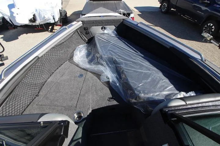 Slide: The Image of Interior view of 2026 Lund 2275 Baron boat, featuring spacious seating and storage. - 6