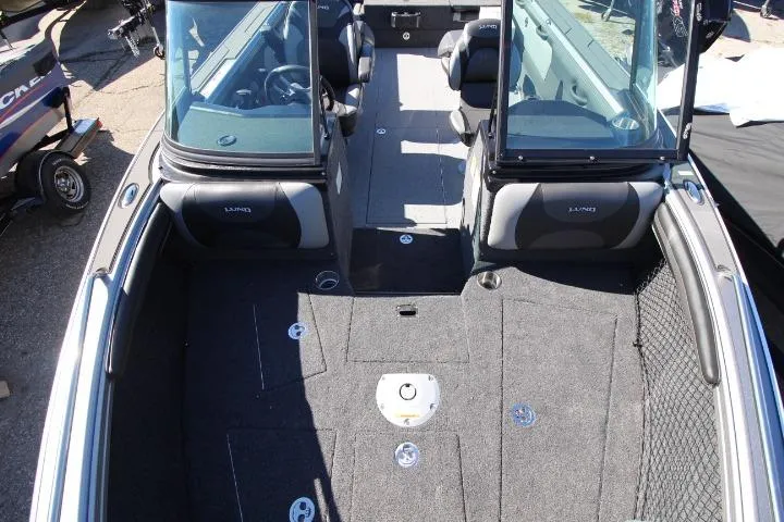 Slide: The Image of 2026 Lund 2275 Baron boat interior with spacious seating and modern design. - 7