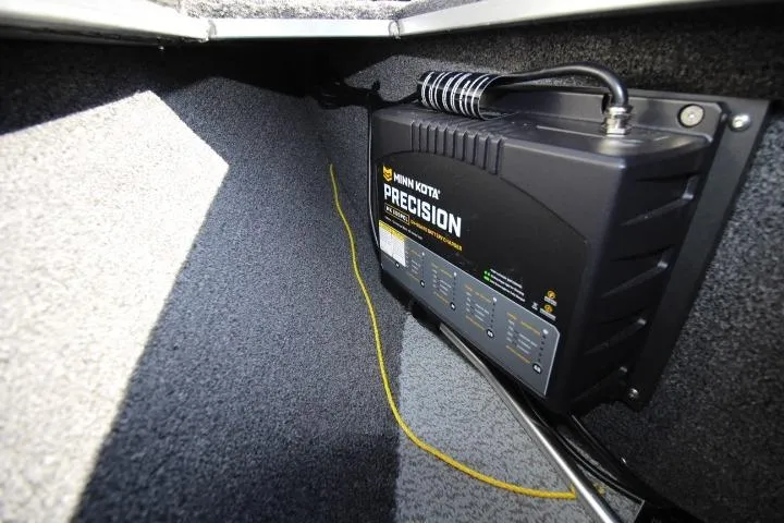 Slide: The Image of Minn Kota Precision charger in 2026 Lund 2275 Baron boat interior. - 8