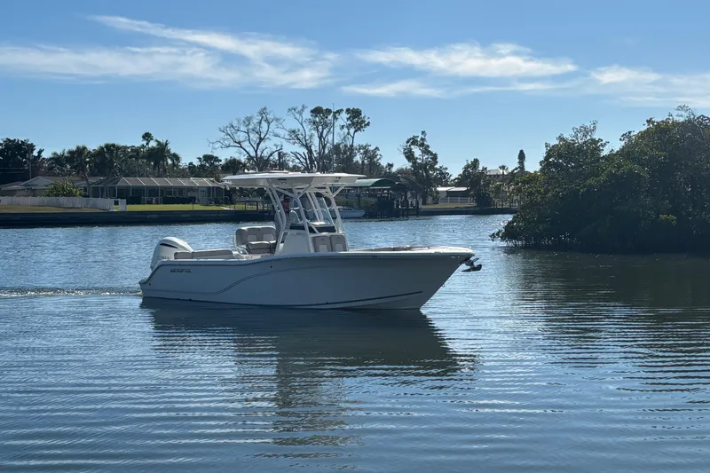 The Image of 2018 Sea Fox 248 Commander boat cruising on a calm, scenic waterway. - 1