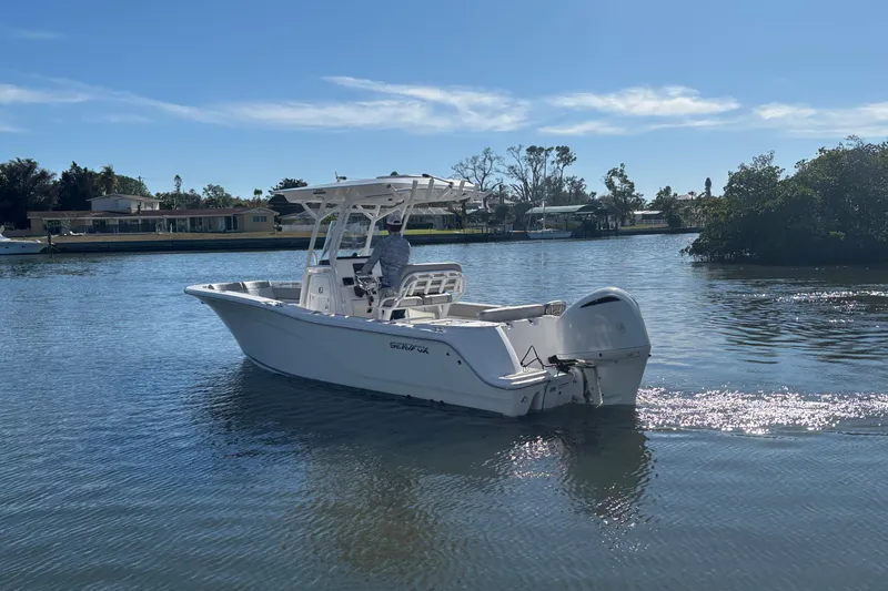 Slide: The Image of 2018 Sea Fox 248 Commander boat cruising on a sunny day in calm waters. - 6