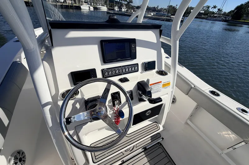 Slide: The Image of 2018 Sea Fox 248 Commander boat console with steering wheel and navigation controls. - 8