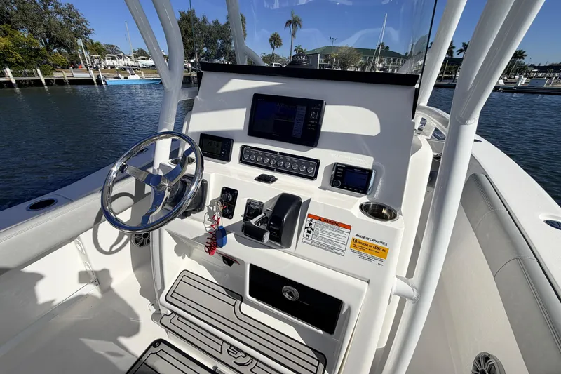 Slide: The Image of 2018 Sea Fox 248 Commander boat console with steering wheel and navigation controls. - 9