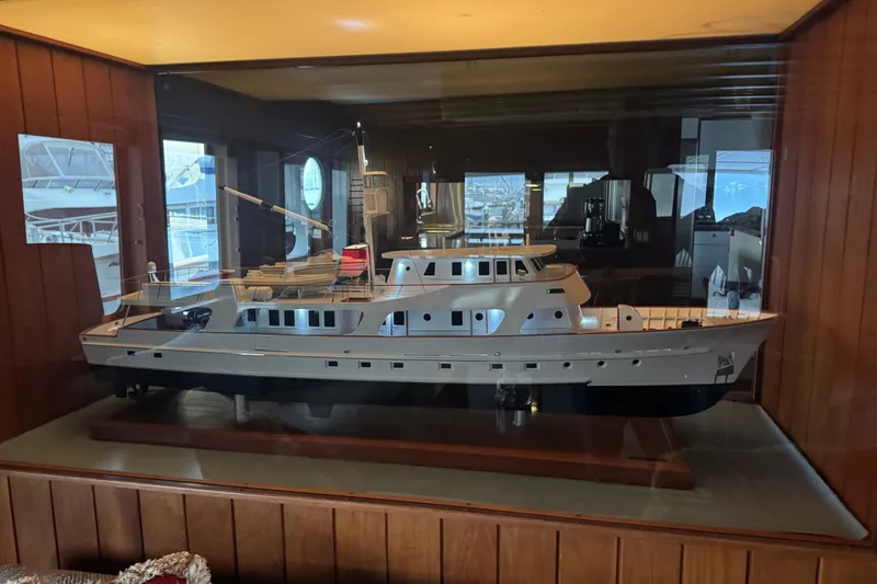 Slide: The Image of Model of 1974 Willard 1201 yacht displayed in a glass case. - 15