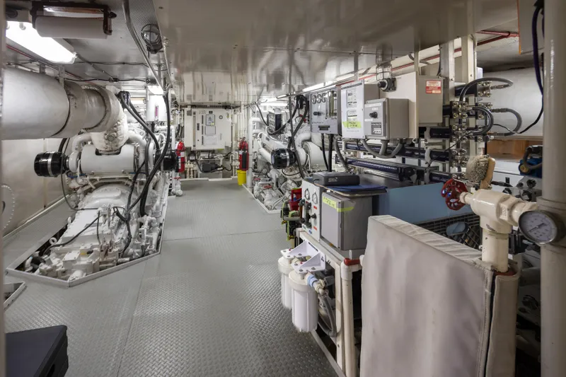 Slide: The Image of Engine room of a 1974 Willard 1201 vessel, featuring complex machinery and control panels. - 18