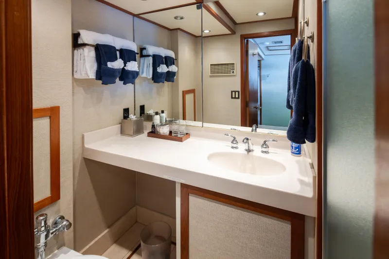 Slide: The Image of Luxurious bathroom interior on a 1974 Willard 1201 yacht, featuring elegant fixtures and plush towels. - 29