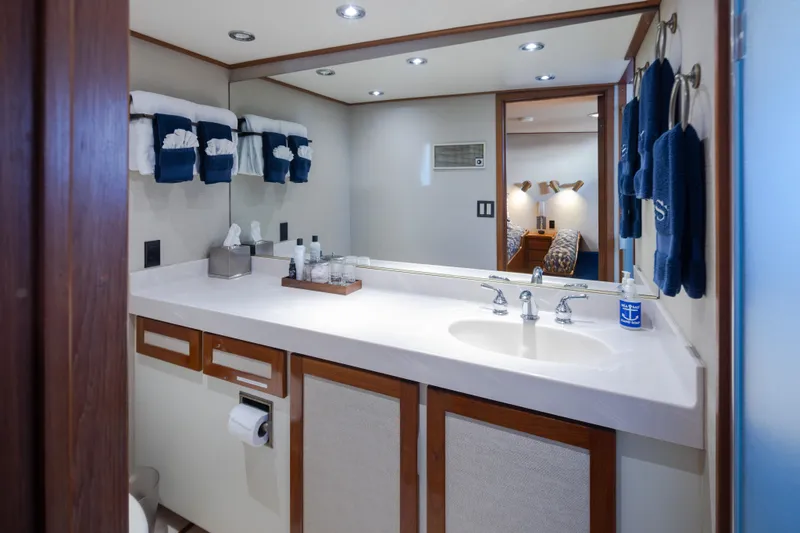 Slide: The Image of Luxurious bathroom in a 1974 Willard 1201 yacht, featuring elegant fixtures and plush towels. - 32