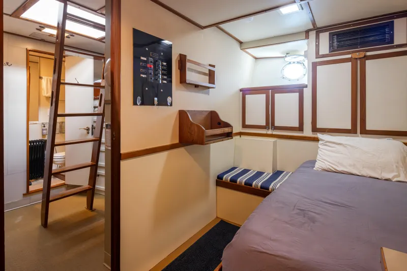 Slide: The Image of 1974 Willard 1201 boat interior with bed, ladder, and bathroom. - 38