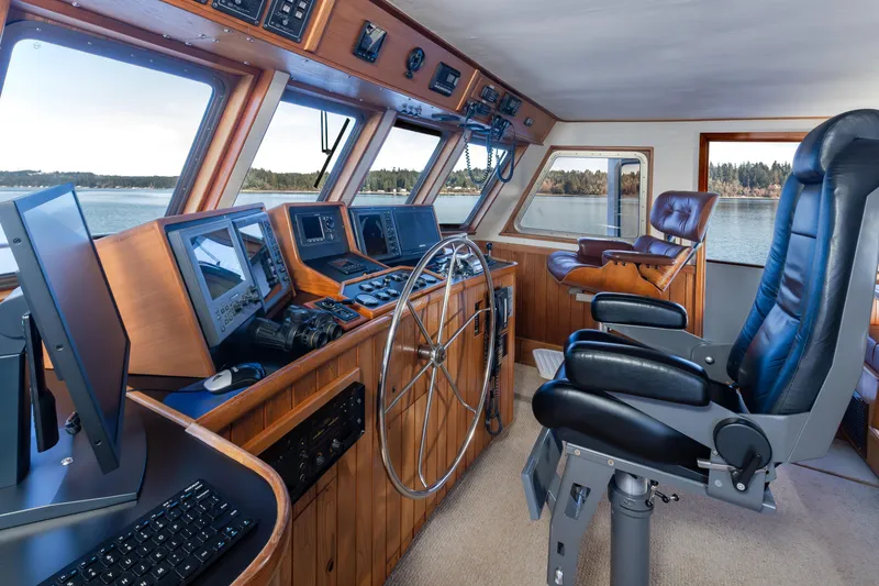 Slide: The Image of Interior of 1974 Willard 1201 boat cockpit with navigation equipment and captain's chair. - 44
