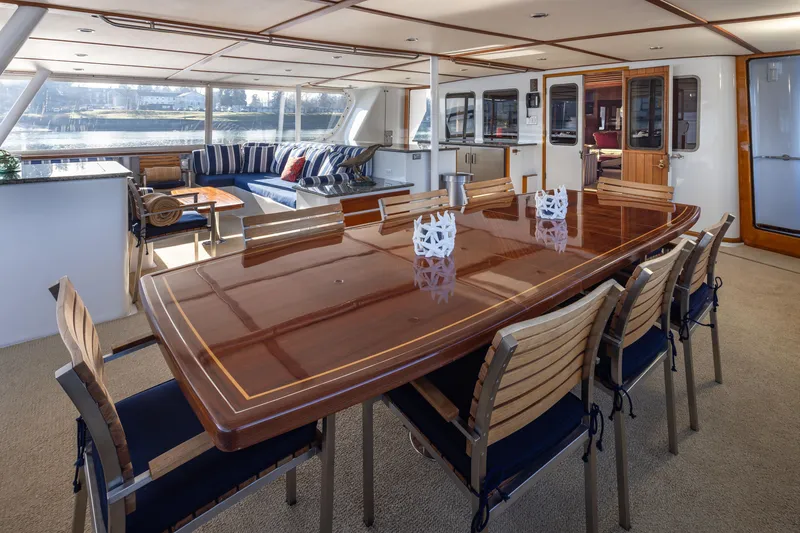 Slide: The Image of Luxurious interior of 1974 Willard 1201 yacht with elegant dining area and scenic views. - 51