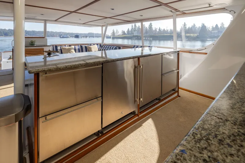 Slide: The Image of Luxurious 1974 Willard 1201 yacht interior with modern kitchen and scenic water view. - 53