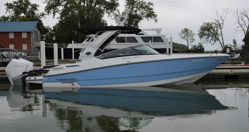 Slide: The Image of 2023 Monterey 305SS Super Sport boat at dock. - 2