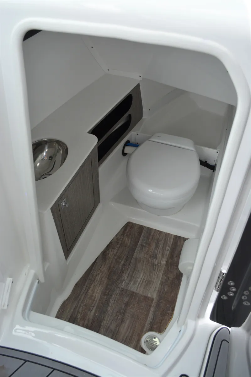 Slide: The Image of Interior of 2023 Monterey 305SS Super Sport with toilet and sink. - 20