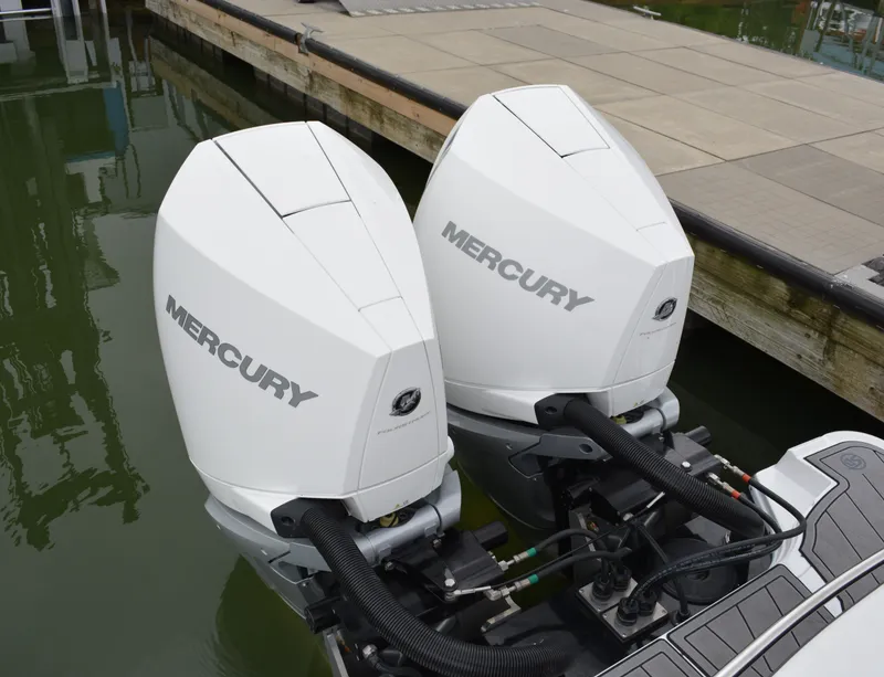 Slide: The Image of Two Mercury outboard engines on a 2023 Monterey 305SS Super Sport boat. - 7