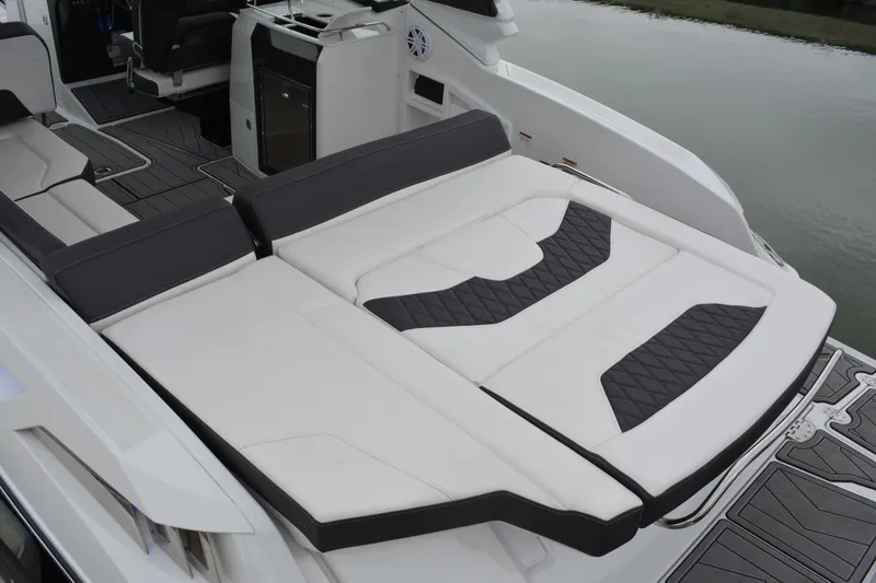 Slide: The Image of 2023 Monterey 305SS Super Sport boat with luxurious lounging area. - 9
