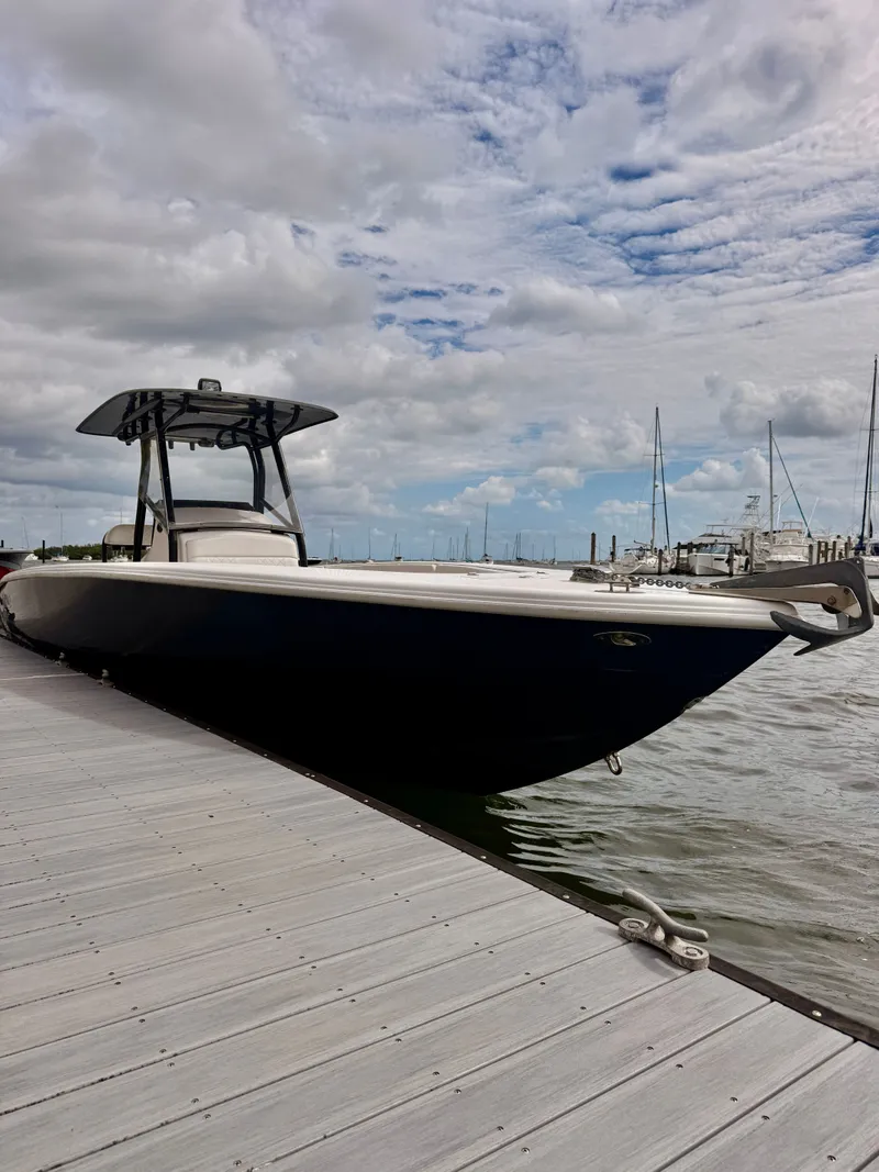 Slide: The Image of 2008 Carrera Powerboats 32 Center Console at dock, cloudy sky. - 16