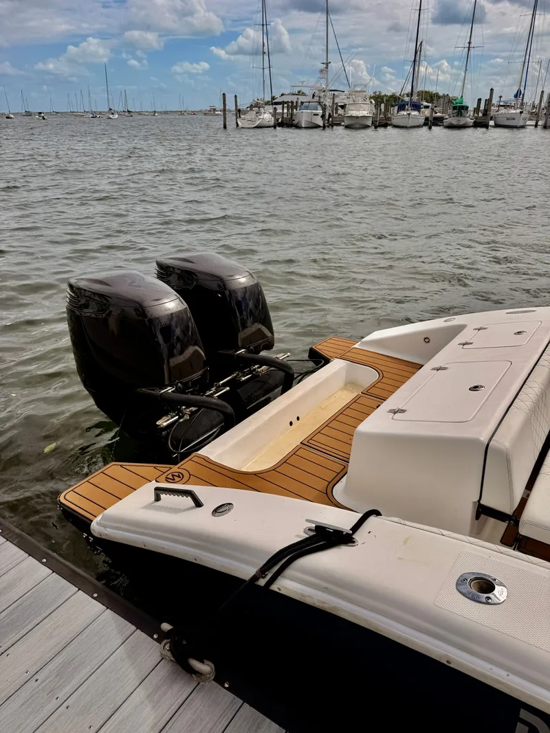 Slide: The Image of 2008 Carrera Powerboats 32 Center Console at dock with twin engines. - 17