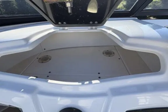 Slide: The Image of Open storage compartment of 2022 Tahoe 200 S boat, featuring spacious interior design. - 24