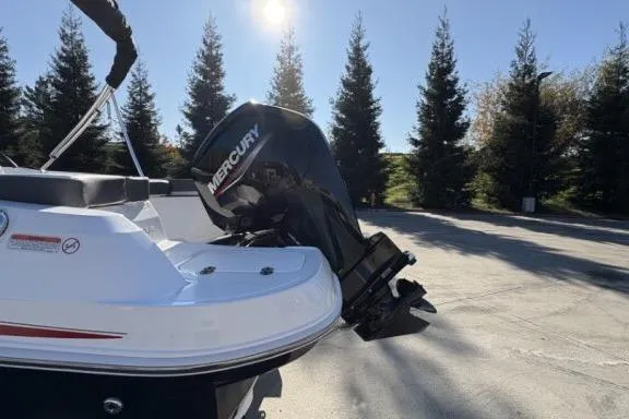 Slide: The Image of 2022 Tahoe 200 S boat with Mercury outboard motor in sunny outdoor setting. - 7