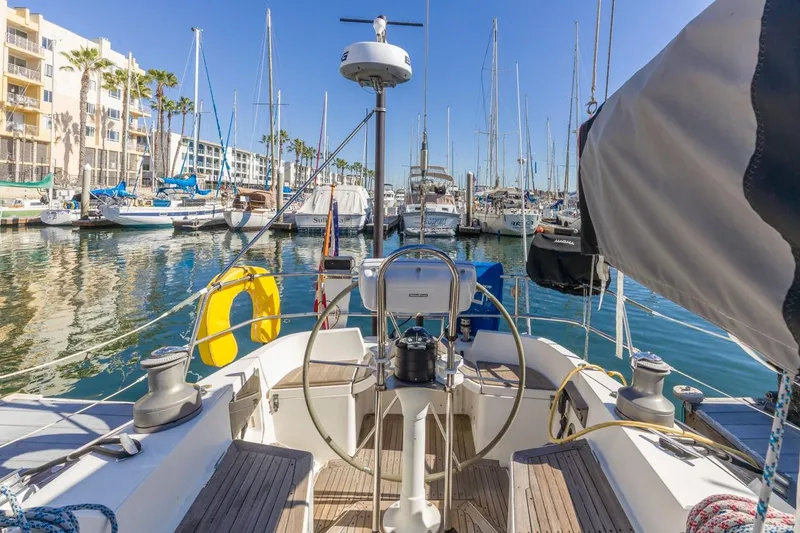 Slide: The Image of Cockpit view of 1983 Baltic 42 DP sailboat docked in a sunny marina. - 23