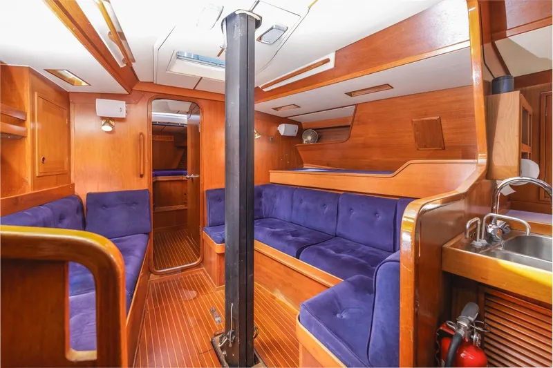 Slide: The Image of Interior of 1983 Baltic 42 DP yacht with wooden finish and blue seating. - 27