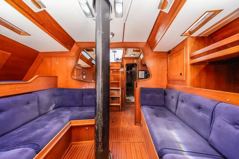 Slide: The Image of Luxurious interior of 1983 Baltic 42 DP yacht with wooden finish and blue seating. - 31