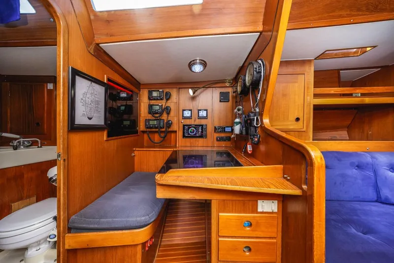 Slide: The Image of Interior of 1983 Baltic 42 DP yacht with navigation station and wooden cabinetry. - 32