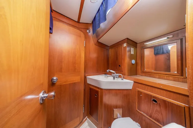Slide: The Image of 1983 Baltic 42 DP yacht bathroom with wooden interior and compact sink. - 35