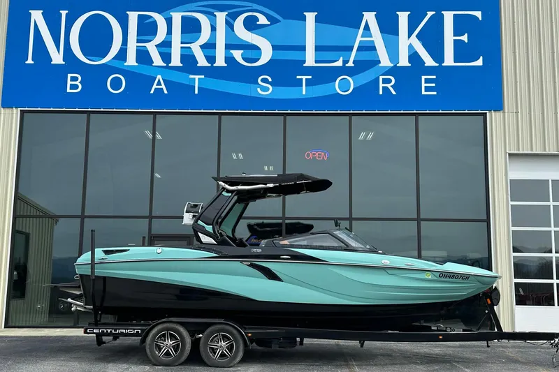 The Image of 2022 Centurion Fi23 boat at Norris Lake Boat Store, displayed on a trailer. - 1
