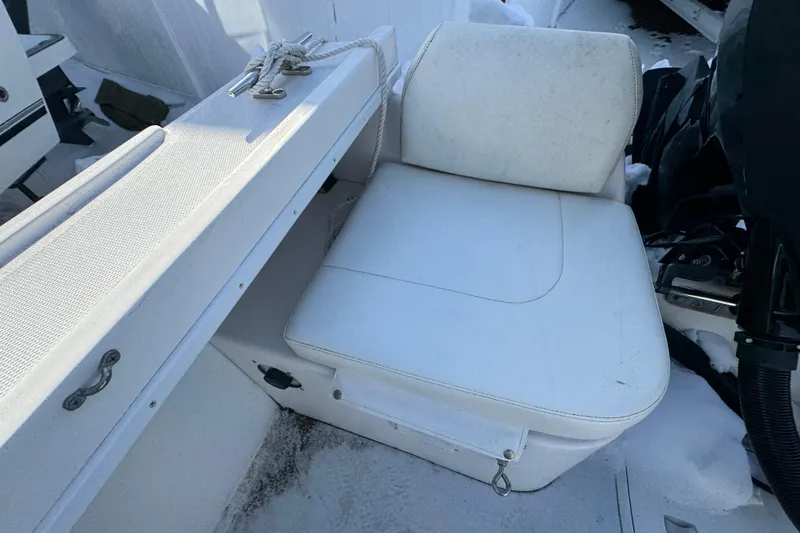Slide: The Image of 2008 Steiger Craft 23 Miami boat seat with white upholstery and deck details. - 18