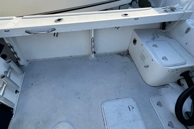 Slide: The Image of 2008 Steiger Craft 23 Miami boat deck with storage compartments and rod holders. - 2