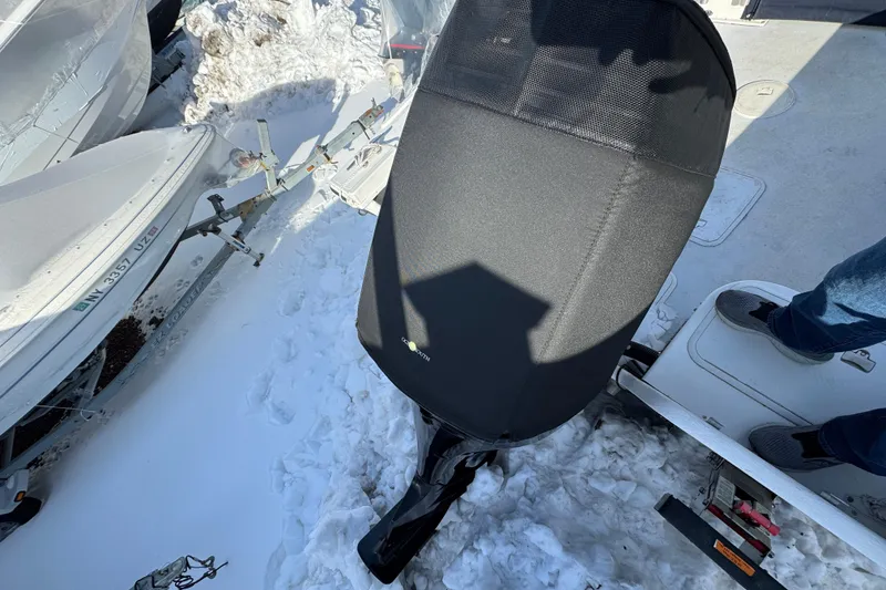 Slide: The Image of 2008 Steiger Craft 23 Miami boat in snowy setting with covered outboard motor. - 22