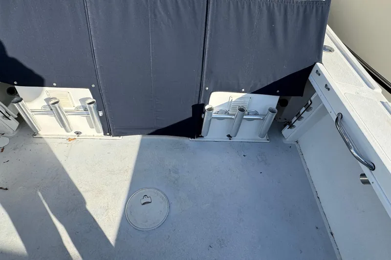 Slide: The Image of 2008 Steiger Craft 23 Miami boat deck with rod holders and storage compartments. - 4