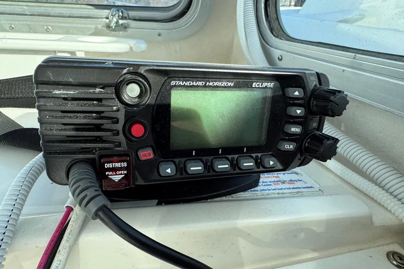 Slide: The Image of Standard Horizon Eclipse marine radio on 2008 Steiger Craft 23 Miami boat dashboard. - 9