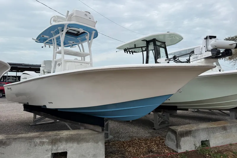 The Image of 2026 Tidewater 2500 Carolina Bay boat displayed on a stand, showcasing sleek design. - 0