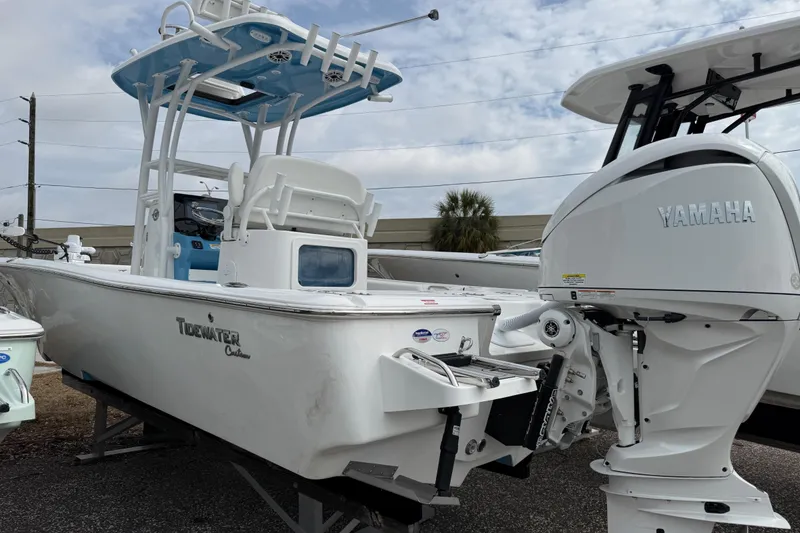 Slide: The Image of 2026 Tidewater 2500 Carolina Bay boat with Yamaha engine, displayed outdoors. - 3