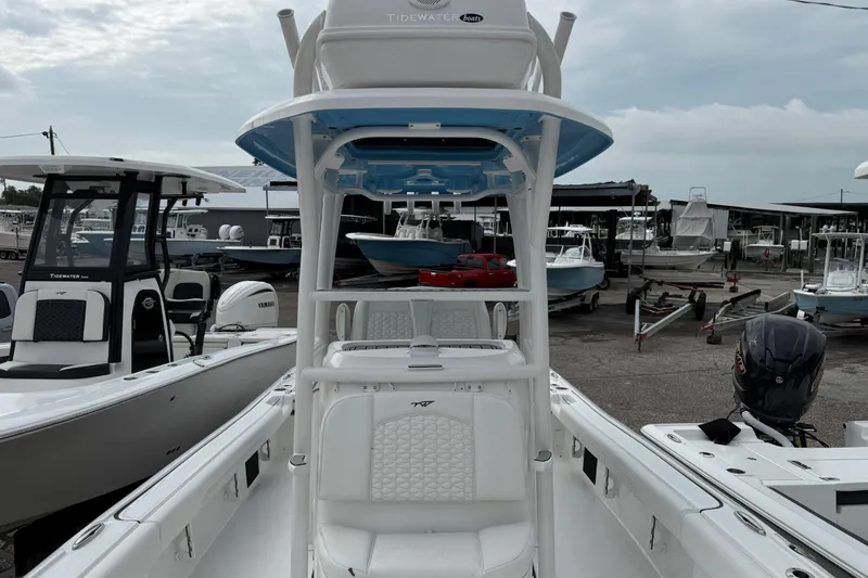 Slide: The Image of 2026 Tidewater 2500 Carolina Bay boat at marina, showcasing sleek design and modern features. - 5