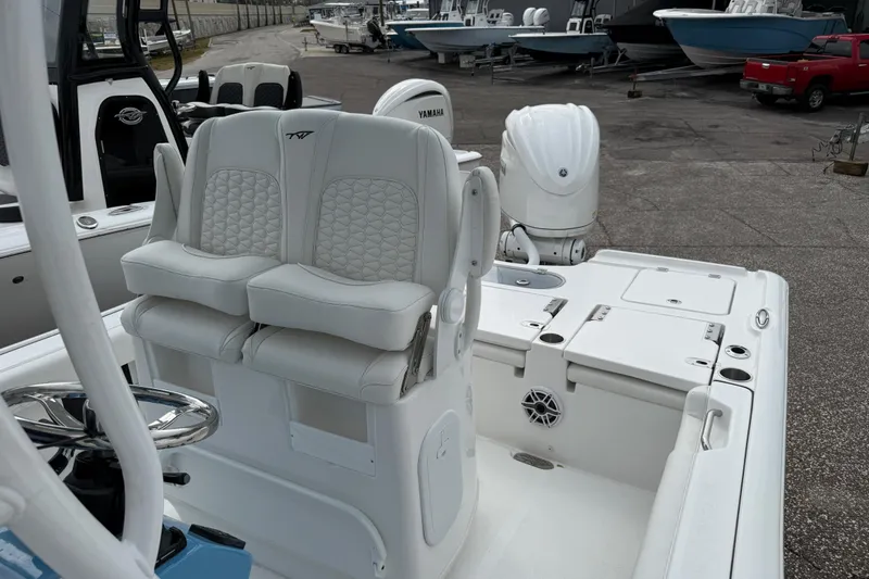 Slide: The Image of 2026 Tidewater 2500 Carolina Bay boat interior with dual seats and Yamaha engine. - 6